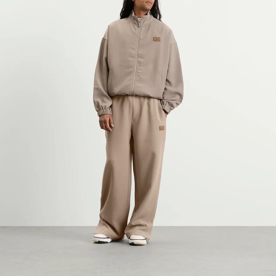 Amiri Patch Cady Track Pant — Dark Sand — on model