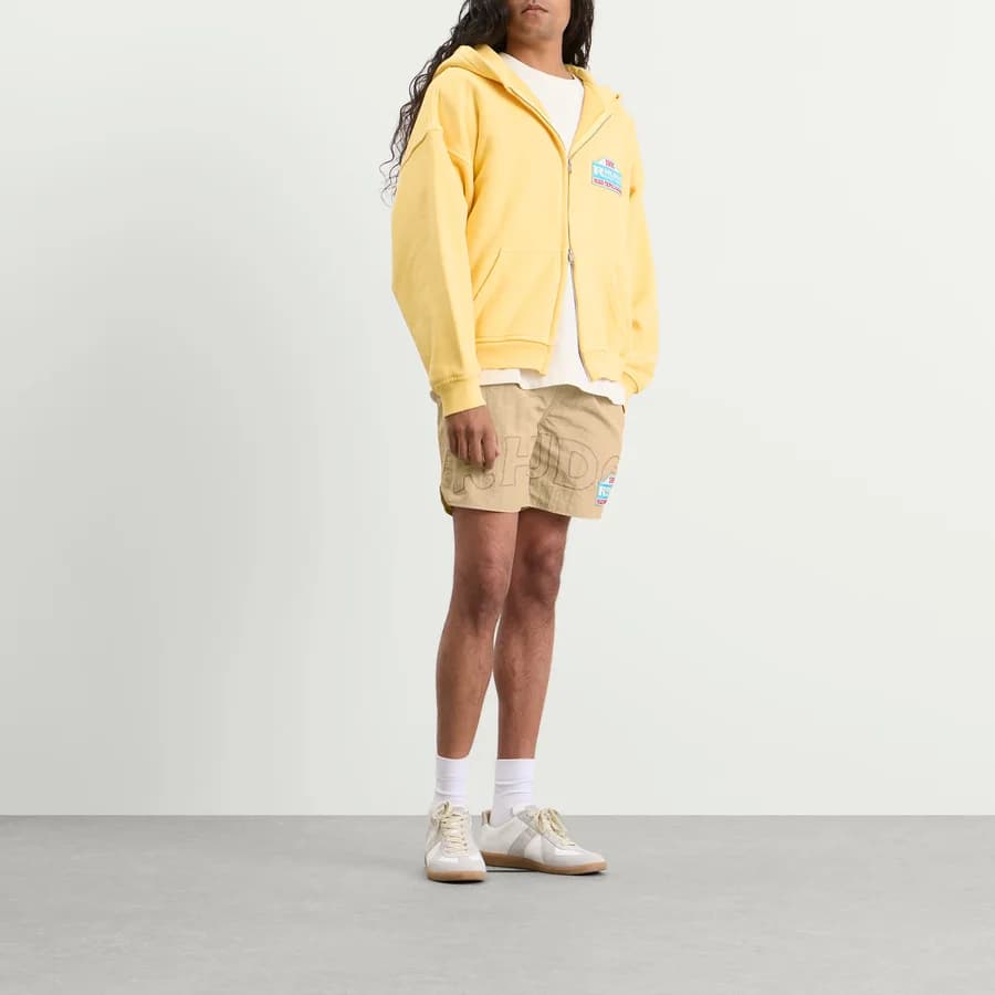 Tripoli Rally Team Short — Tan — on model