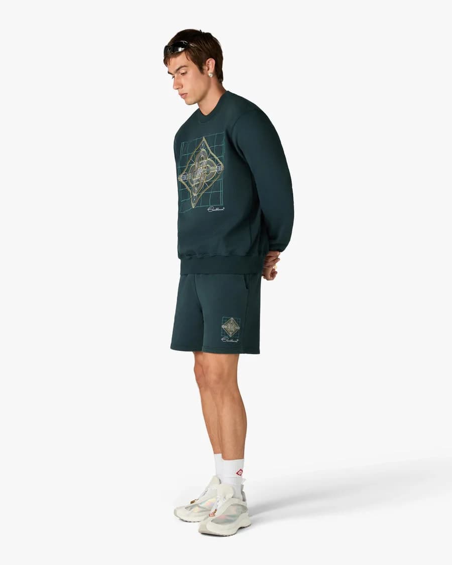 Dark Teal Geometrie Sacree Embroidered Shorts — on model
